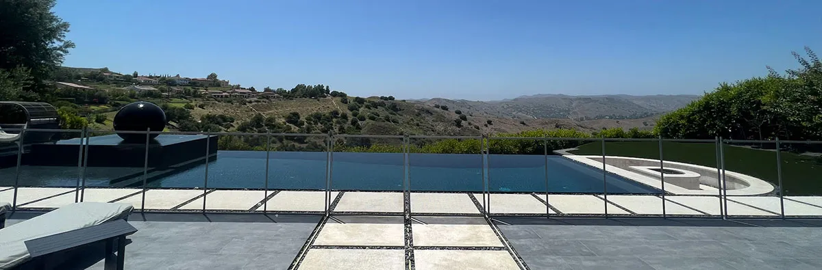Glass balustrade along an elevated pool deck